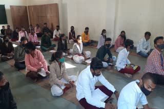 students Sitting on floor