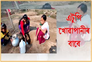 Digging sand pits for drinking water in Amguri