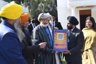 PM Modi meets an Afghan Sikh-Hindu delegation at his residence in Delhi