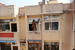 woman stand outside of her house window on fourth floor to clean in ghaziabad video goes viral