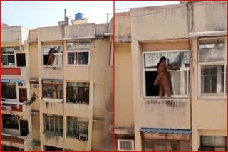 woman cleaning window glasses