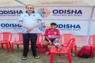 cm naveen patnaik console a footballer during kalinga stadium visit