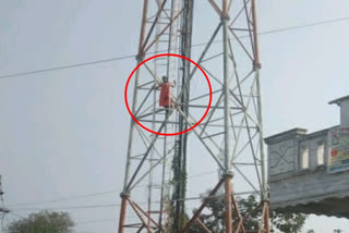 a women climbing cell tower