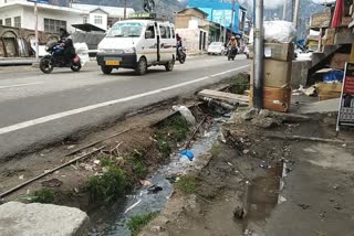 Shopkeeper Disturbed by Filth of Drain