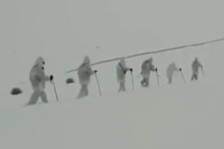 Indian Army troops carrying out patrolling along the Line of Control under heavy snowfall