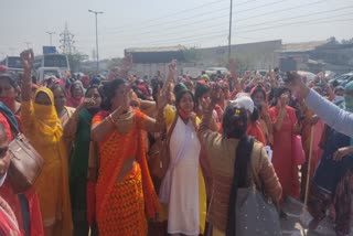 Anganwadi women workers tore banners and posters of launch program of sewage pumping station