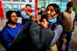 Mansi Singhal, an Indian student studying in Ukraine who fled the conflict, hugs her mother after she arrived at Indira Gandhi International Airport in New Delhi, India, Wednesday, March 2, 2022.