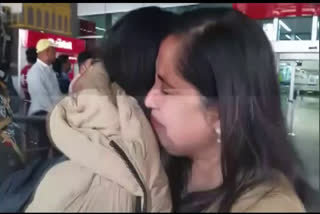 Tears of joy and some sweets at Delhi airport as a mother breaks down on seeing her daughter Saloni