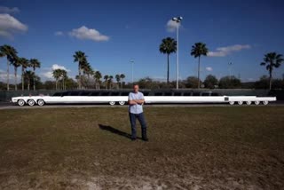 Worlds longest car with a swimming pool helipad and mini-golf course, 100 feet long car, longest car in the world, the american dream car