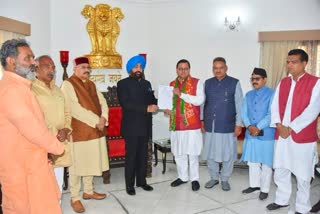 Dhami arrives at the Raj Bhawan