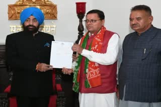 cm dhami submits resignation