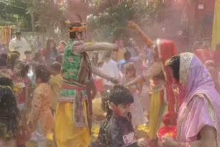 Children splashed flowers and danced on the occasion of holi in gujarat