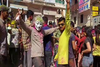 foreign tourists enjoying holi celebration