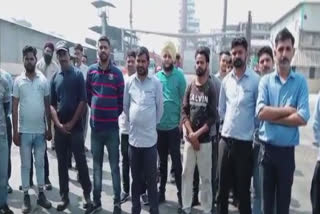 people troubled by smoke and dirty water staged a sit in outside the factory In Hoshiarpur