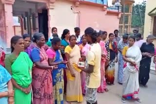 villagers express happiness by distributing sweets over suspension of mandya tahsildar