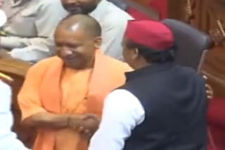 Yogi Adityanath shakes hand with Akhilesh Yadav