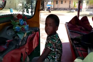 Sitting near the dead body of his mother and sister five year old boy cried