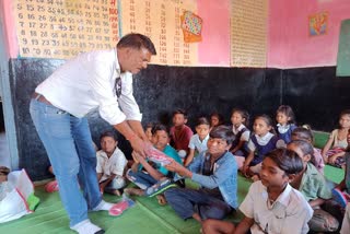 teacher distributed slippers to children