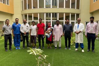 Boy with Parents and Doctors team