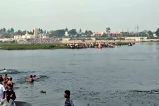 people take holy dip in triveni sangam