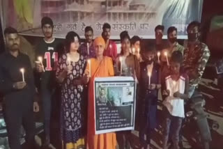 Candle march in protest against lynching of dog