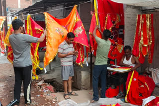 Muslim artisans making Mahaviri flag