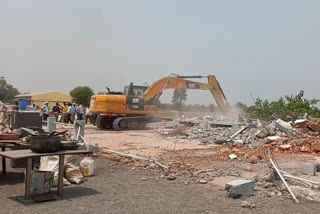 Bulldozer on illegal hotel Sagar