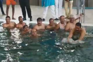 Patil Yatnal jumps into swimming pool after ingaurating swimming pool
