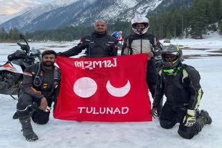 Bike riders flying the Tulunad flag at Sikkim Katav