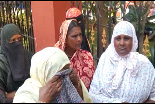 Relatives shout in front of the court that the detainees are innocent