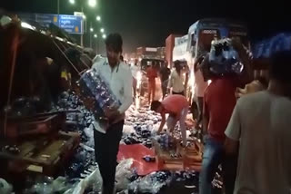thumps up bottles load lorry overturned at taramathipet and people carried  all bottles