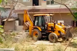 Corporation bulldozer ran on illegal boundary wall