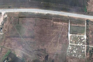 Satellite photos of what appeared to be rows upon rows of freshly dug mass graves on the outskirts of Mariupol brought the horrors of the war increasingly into focus, as Russia pounded away Friday at Ukrainian holdouts in the city's steel mill and other targets in a drive to seize the country's industrial east