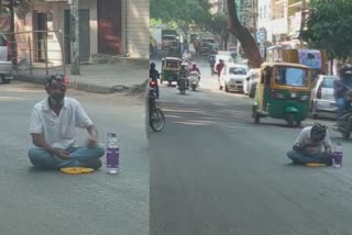 drunk man eats breakfast in the middle of the road  drunk eats in road in bengaluru  മദ്യപിച്ച് നടുറോഡിൽ ഇരുന്ന് ഭക്ഷണം കഴിച്ചു  ബെംഗളുരു റോഡ് തിരക്ക്