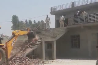 bulldozer on Morena sarpanch home