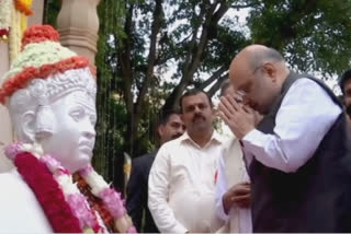 Amit Shah garlands statue of Basaveshwara on Basava Jayanti