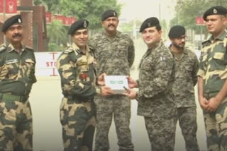 BSF, Pakistan Rangers exchange sweets at Attari border on Eid-ul-Fitr