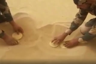 Searing summer: Soldiers roast papads in sand