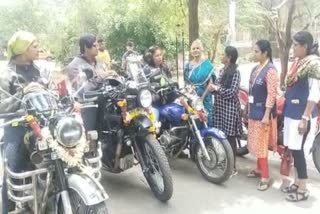 Four women ride a bike to raise awareness among females