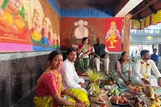 Son married in front of his father statue