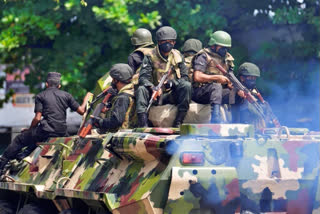 In frames: Troops on roads after wave of violence in crisis-hit Sri Lanka