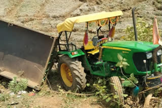 Tractor overturns