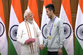 Lakshya Sen meets PM Modi, Lakshya Sen gifts Bal Mithai to PM Modi, Modi meets Thomas Cup winners, Modi meets shuttlers