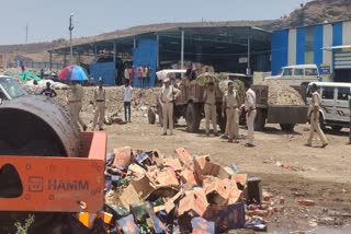 Illegal liquor worth 51 lakhs destroyed by bulldozer