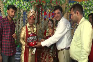 bride and groom distributed helmet