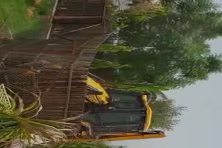 noida-authority-bulldozer-ran-on-a-dozen-illegal-farm-houses