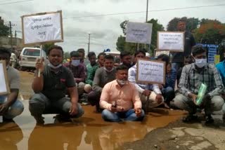 Protesting by sitting in water-filled pits