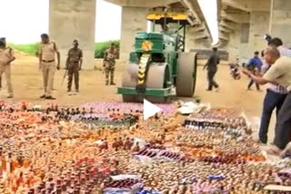 ap police destroyed two crore worth liquor with road roller