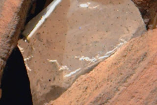 NASA Mars rover spots shiny foil piece between rocks