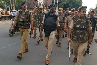 Police officers patrol in Noida